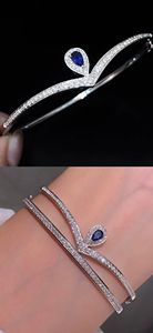Xinfly Hot Sale Stacked Fine Jewelry 18K Pure White Gold Row Diamond VS <b>Ruby</b> Sapphire V Shape Water Drop Pendant Bangles - Product Image 4