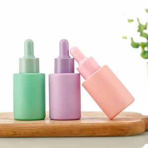 ขวดแก้วฝ้าสีสันสดใสขนาด 30 มล. พร้อมหัวหยดเซรั่มสีสันสดใส พิมพ์ลายสกรีน สำหรับเครื่องสำอางและน้ำมันหอมระเหย รุ่น Mairun 406 จากสหรัฐอเมริกา - Product Image 1