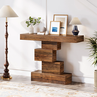 Une pile de livres sur la table console de la ferme, design de couloir, table console chinoise avec base géométrique