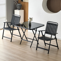 Table pliante carrée en verre avec structure en métal noir et acier inoxydable, idéale pour le jardin, la plage et la terrasse des restaurants