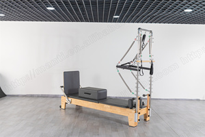 เครื่องพิลาทิสอเนกประสงค์ที่ทนทาน พร้อมเตียงเลื่อนและเตียงแกนกลางสีขาวแบบกึ่งยกสูง  พร้อมอุปกรณ์ทาวเวอร์รีฟอร์เมอร์ไม้ - Product Image 2