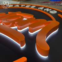 Enseigne LED ronde rétroéclairée personnalisée avec accents orange et blancs pour garage ou entreprise