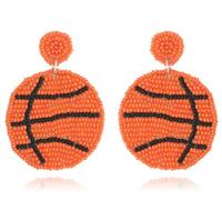 Vente en gros de boucles d'oreilles bohèmes créatives en perles pour le sport softball, le baseball, le football, le basket et le rugby.