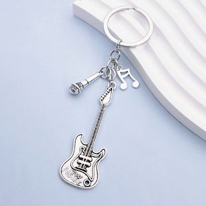 <span class=keywords><strong>Instrument</strong></span> de <span class=keywords><strong>musique</strong></span> créatif pendentif événement <span class=keywords><strong>cadeau</strong></span> sac pendentif métal laque guitare <span class=keywords><strong>porte</strong></span>-clés - Product Image 3