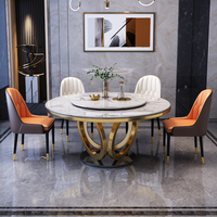 Luxuriöses Rundes Esszimmer-Set mit 4 Stühlen Gesinterter Steinoberfläche Drehbare Mittelplatte Goldene Säulenbasis für Zuhause
