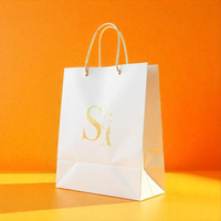 Sac de papier cadeau commercial de luxe personnalisé OEM avec impression de timbres couleur or couleur logo unique