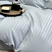 Parure de lit en coton bleu côtier 4 pièces avec housse de couette rayée en satin, drap plat et taies d'oreiller pour chambre d'enfant ou chambre d'invité