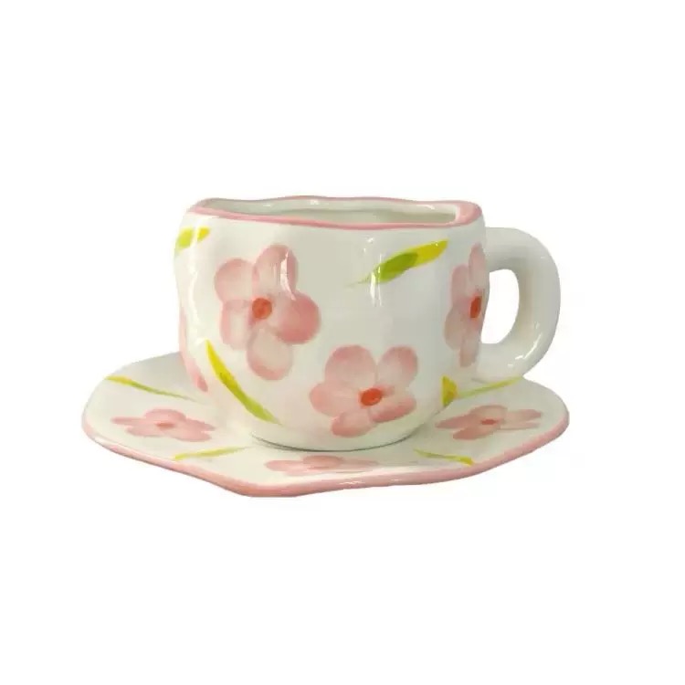 White background with pink flowers - hand-held cups and plates