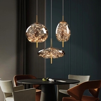 Lustre LED suspendu moderne de luxe, nouveau modèle étoile, décoratif, pour salle à manger, en verre nordique, à fixation murale simple