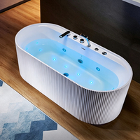 Baignoire autoportante ovale de luxe en acrylique cannelé avec LED, chromothérapie, jets d'air et hydrothérapie massante