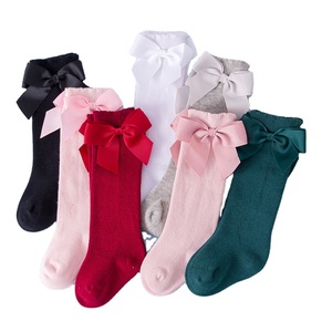 Chaussons longs mignons pour bébés et enfants Chaussettes hautes à nœud Princesse Chaussettes espagnoles de couleur unie avec nœuds - Product Image 1