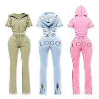Ensemble 2 pièces pour femme style urbain 2026 : Veste zippée à manches courtes avec surpiqûres contrastées et pantalon évasé délavé à l'acide