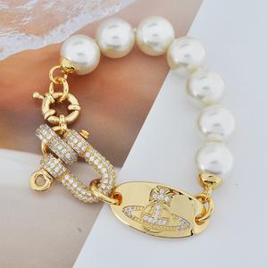 Pulsera y Collar Unisex de Alta Gama con Cuentas de Perlas Saturno y Hebilla en Forma de Herradura en U con Diamantes Completos, Estilo Emperatriz Viuda Vivienne - Product Image 3