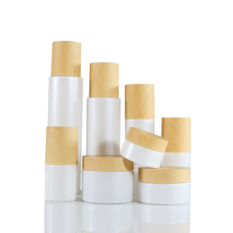 Низкий минимальный заказ, роскошный пустой цилиндр, матовая стеклянная бутылка с тонером для лица, бутылка с насосом для лосьона, баночка для крема, набор контейнеров с деревянной крышкой