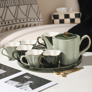 Juego de Tetera de Porcelana con Borde Dorado y Trébol de Cuatro Hojas Estilo Francés, con Infusor, Taza de Café, Platillo, Azucarera y Jarra para Leche - Product Image 1