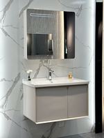 Meuble de salle de bain mural moderne en acier inoxydable résistant à l'eau avec lavabo en céramique et miroir intelligent pour hôtel/appartement