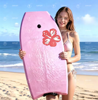 Planche de surf rose pour la plage, adaptée aux débutants