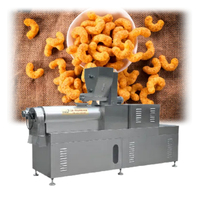 Ligne de traitement automatique de casse-croûte de bouffées de maïs de machine d'extrudeuse de casse-croûte de forme d'Ohter à haute efficacité pour la production à grande échelle nouveau