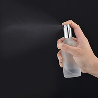 Bouteilles vides transparentes givrées réutilisables Flacons pulvérisateurs en verre de 50ml Tête de pulvérisation en verre dépoli argenté