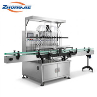 Remplisseuse automatique de liquides Zhongjie haute précision à 12 têtes avec pompe à engrenages magnétique 316L anti-mousse et levage servo pour eau et boissons