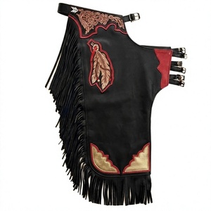 Chaparreras de cuero negro personalizadas para rodeo, con yugo floral tallado a mano, parche de plumas, ribete dorado y flecos, de longitud completa. - Product Image 1