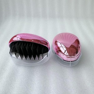 Cepillo de pelo en forma de huevo Peine desenredante de plástico Cabeza Masaje del cuero cabelludo Peine Salón Ducha Herramientas de peinado - Product Image 4