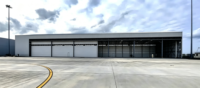 Hangar d'avion préfabriqué en acier, conception personnalisée résistante aux vents, installation rapide, structure métallique économique pour le stockage d'avions privés