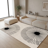 Grand tapis moderne Sunburst 8x10 noir et crème à motif géométrique radial pour salon et décoration intérieure
