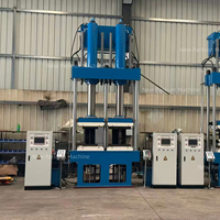 Presse de vulcanisation verticale à double moule pour ressorts pneumatiques, machine de vulcanisation de caoutchouc servo-hydraulique pour suspensions