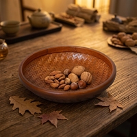 Panier de rangement rond en bambou tressé chinois moderne avec design portable et durable pour fruits, aliments et collations