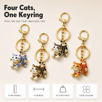 Porte-clés en métal en forme de chat ajouré avec pendentif strass, fermoir mousqueton, breloque pour voiture, sac ou téléphone
