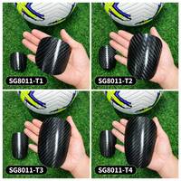 Protège-tibias de football en fibre de carbone personnalisés, légers, avec impression de logo OEM/ODM pour l'entraînement des équipes, fourniture directe usine