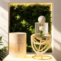 Flacon de parfum vide Minimaluxe en verre avec une forme de fleur unique à l'intérieur, flacon élégant