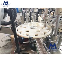 Machine automatique de remplissage et de bouchage de flacons de parfum, de liquides cosmétiques et de vaporisateurs de parfum