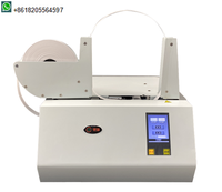 Machine automatique de cerclage de billets de banque avec ruban thermoscellant