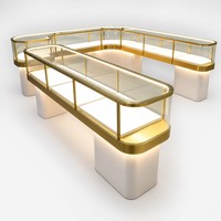 Vitrine de présentation de bijoux sur mesure en verre éclairée par LED, avec cadre doré de luxe et verrouillable, pour la vente en gros