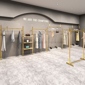 Gli scaffali dorati della <span class=keywords><strong>parete</strong></span> dell'esposizione dello scaffale di esposizione dei vestiti fissato al muro della Boutique appendono l'acciaio inossidabile per il negozio di abbigliamento - Product Image 1