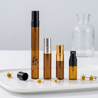 Vente en gros de flacons de parfum ronds en verre ambré de 2 ml/3 ml/10 ml avec pompe pulvérisatrice noire/dorée/argentée sérigraphiée et diffuseur à bâtonnets