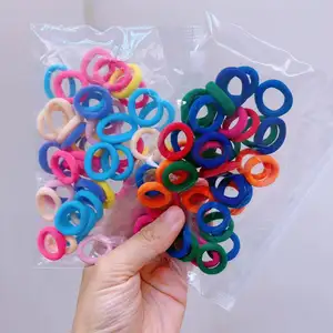 MYLULU, venta al por mayor, color caramelo, lazos elásticos de nailon para el cabello para bebés y niños, 50 Uds., paquete de bolsas, mini lazos elásticos para el cabello para bebés pequeños