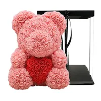 Meilleure vente : Ours en peluche rose artificiel avec fleurs en PE de 25 cm et boîte cadeau transparente