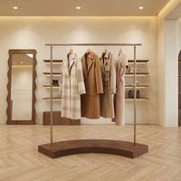 Nouveau design moderne, support d'affichage autoportant en acier inoxydable couleur marron et or pour la protection contre la corrosion, idéal pour les magasins de vêtements