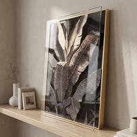 Art mural botanique moderne de luxe noir et or, peinture en porcelaine cristalline à motif de feuilles de bananier tropicales avec cadre en aluminium pour salon