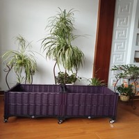 Jardinière rectangulaire en plastique imitation rotin PP, lit de jardin surélevé en osier tressé marron, léger, avec roulettes, trous de drainage et système d'arrosage automatique