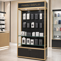 Meuble de présentation mural robuste en métal doré et MDF avec éclairage LED pour magasin de détail, idéal pour la présentation d'accessoires de téléphonie et de produits de vapotage - Offre Spéciale
