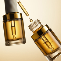 Flacon compte-gouttes en verre transparent de 30ml pour le visage et le corps avec couvercle en or blanc de luxe personnalisé pour cosmétiques