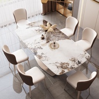 Table à manger moderne en pierre frittée avec base dorée en X et ensemble de chaises en cuir pour hôtel et maison