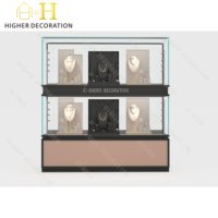 Vitrine à bijoux de luxe avec panneau arrière miroir et étagères en verre pour une visibilité maximale en magasin