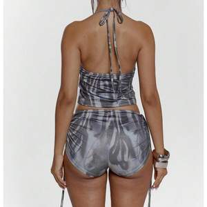 ชุดออกกำลังกายลายม้าลายสำหรับผู้หญิง รุ่นคัสตอม 2026 เสื้อกล้ามแบบผูกคอ กางเกงขาสั้น แห้งเร็ว ผูกเชือก ชุดออกกำลังกาย ผ้าเมมโมรี่ - Product Image 4