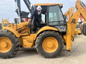 รถตักล้อยาง JCB รุ่น 4CX สีเหลือง มือสอง อุปกรณ์ก่อสร้าง น้ำหนักบรรทุก 9 ตัน เครื่องยนต์คัมมินส์ - Product Image 5