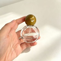Flacon de parfum exquis en forme de globe de 25 ml, mini flacon pulvérisateur en verre avec bouchon en pierre précieuse colorée pour les voyages et les cadeaux